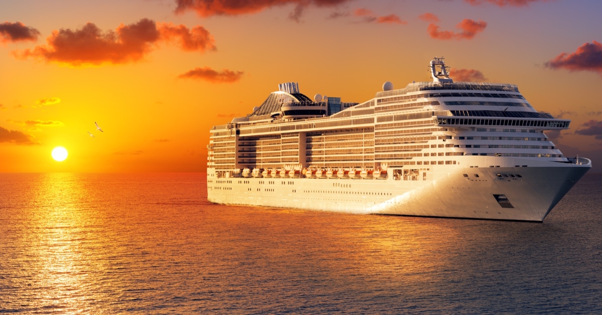 cruise ship at sunset in ocean