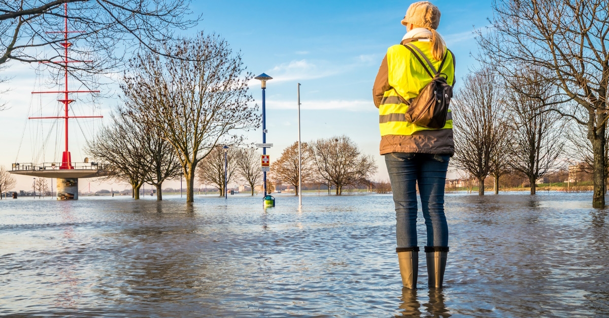 young lady standing in flooded street