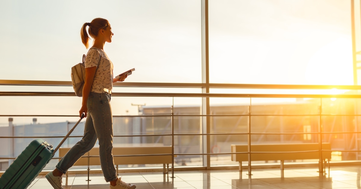 woman with luggage in airport 