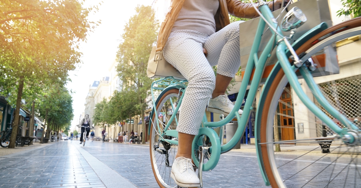 senior woman riding city bike