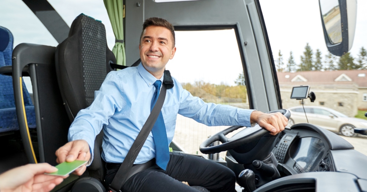 Bus driver accepting passenger's tickets 