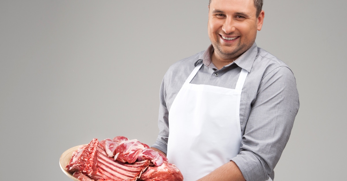 butcher presents the raw meat. 