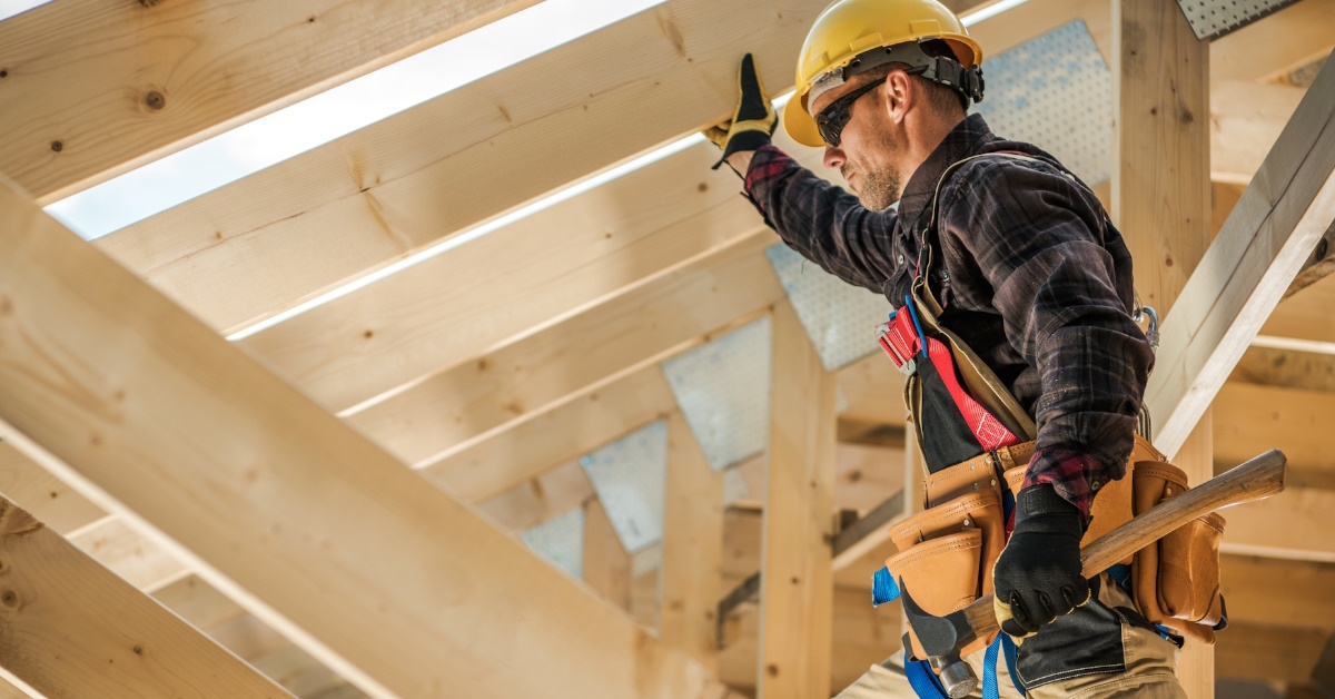 carpenter constructing wooden frames.