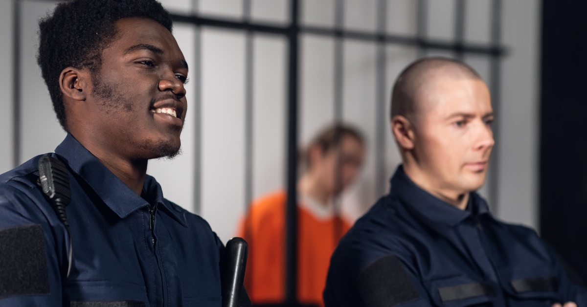 guards standing near criminals cell.