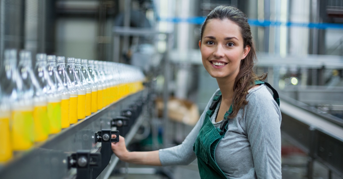 employee standing near production line.