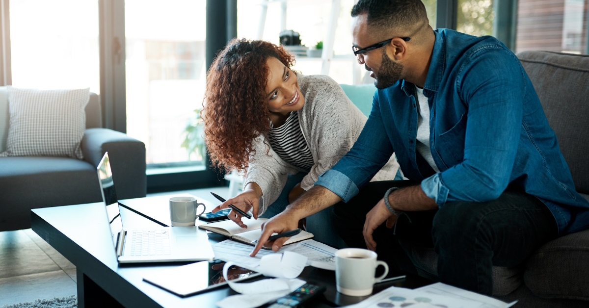 couple at home reviewing bills