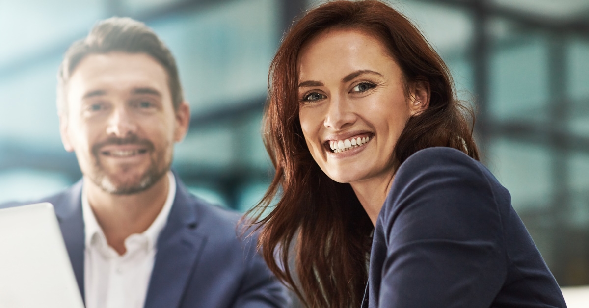 happy colleagues posing in office