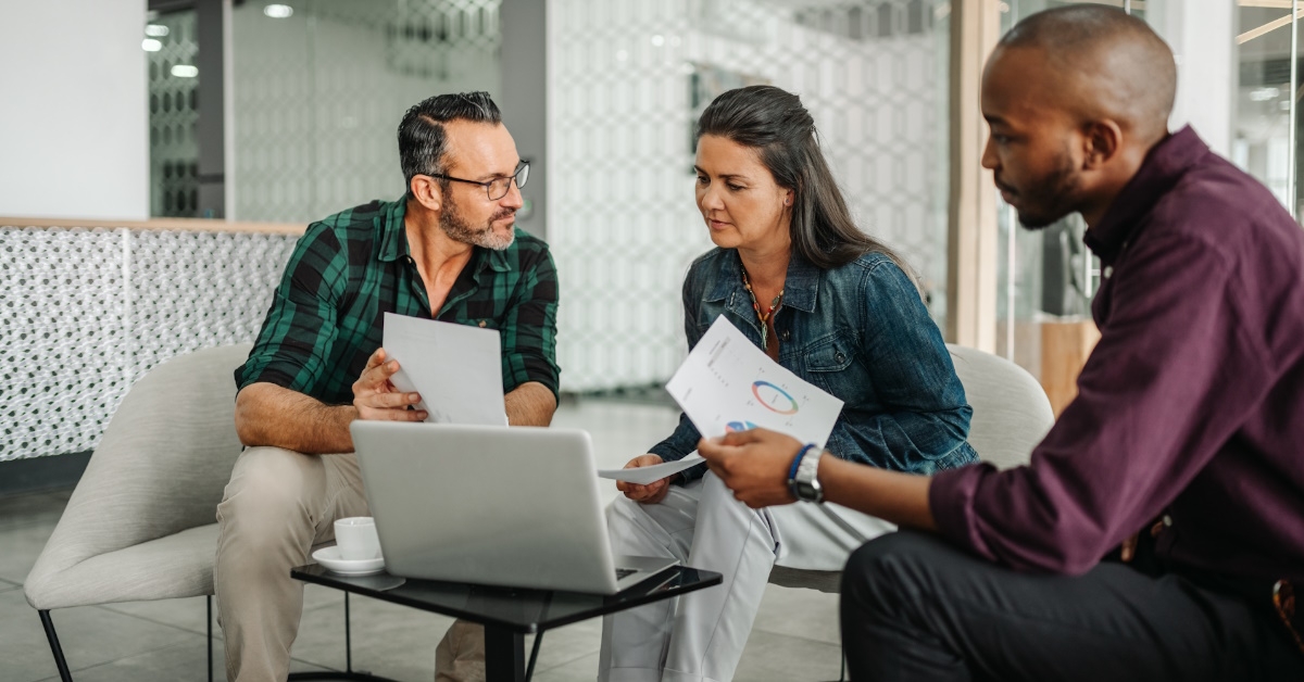 multi ethnic workers discussing work
