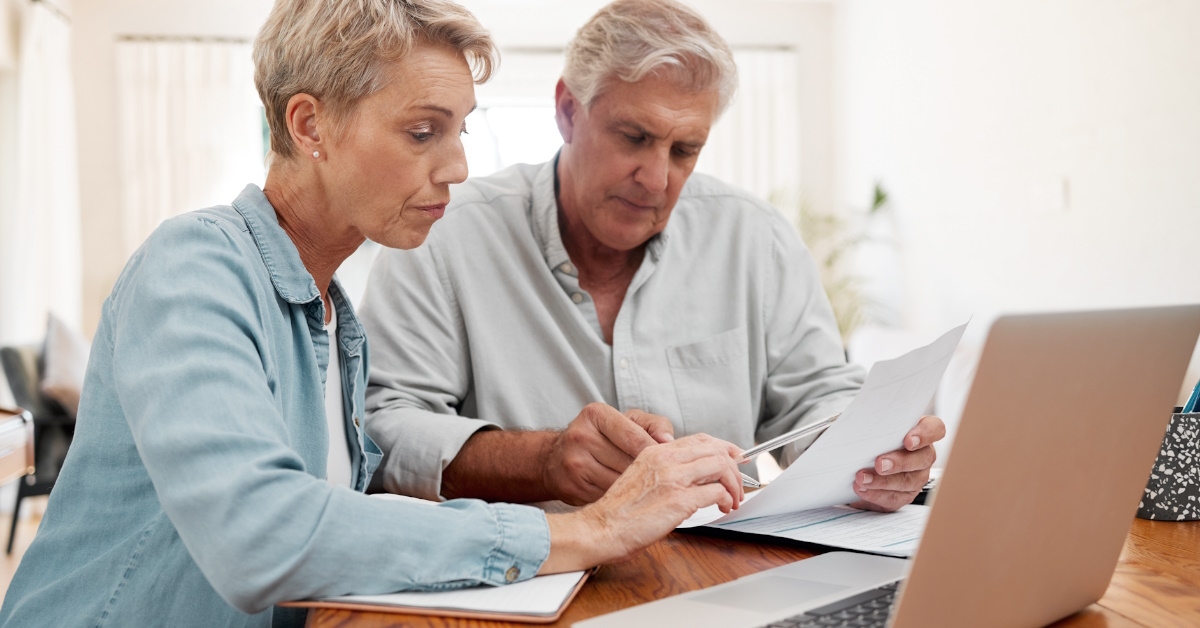 senior couple reviewing bills at home