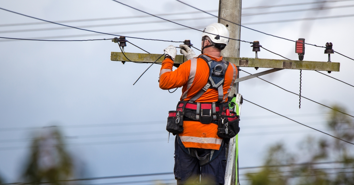 lineman connects a new house