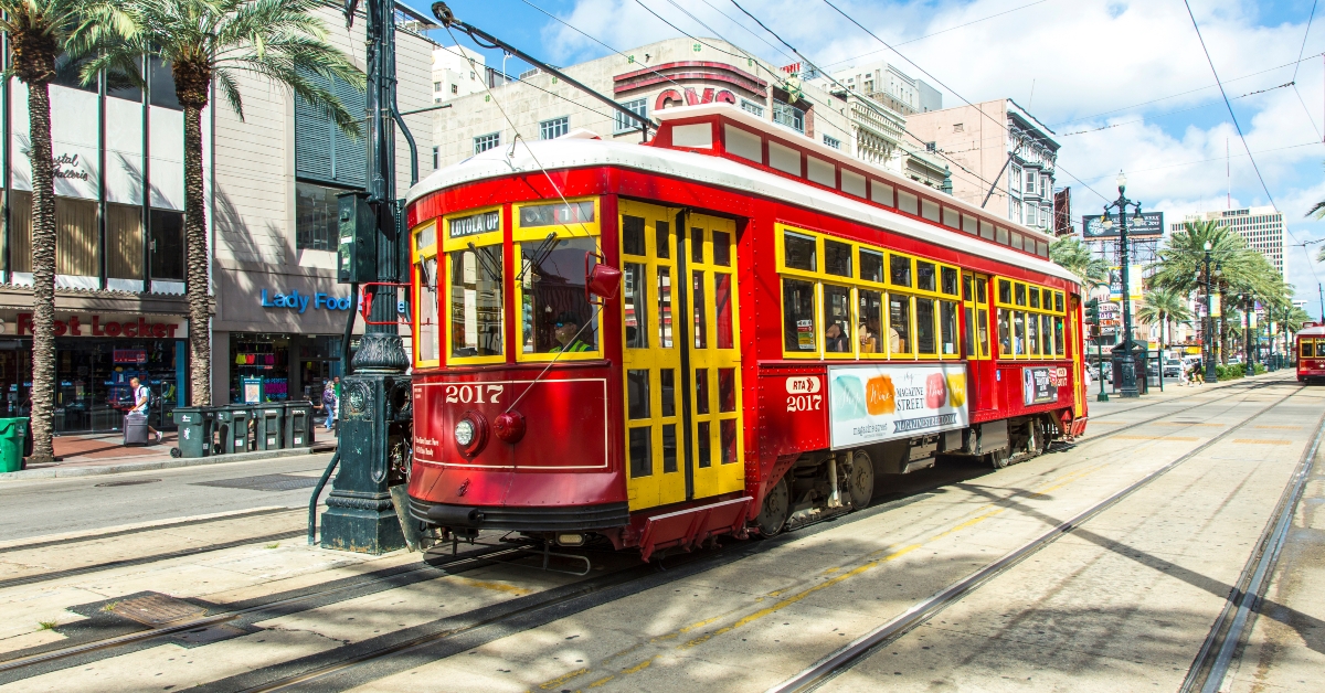 red trolley streetcar on rail