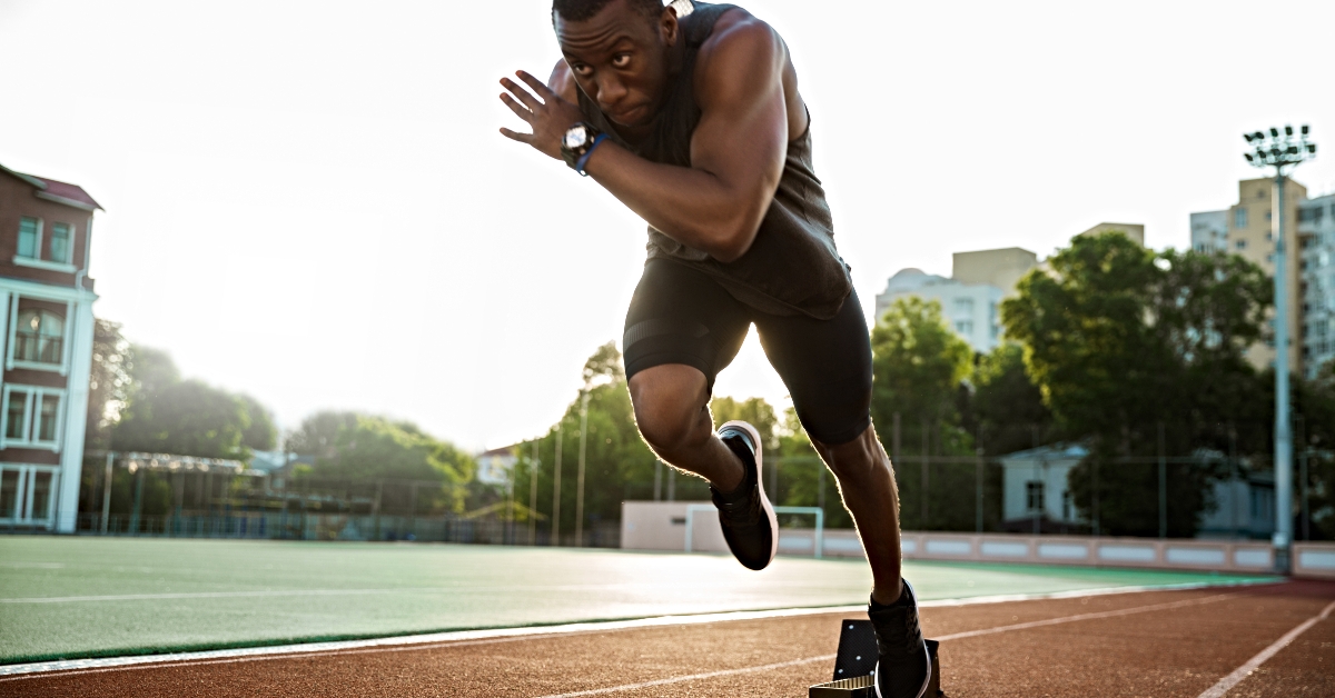 runner running on racetrack