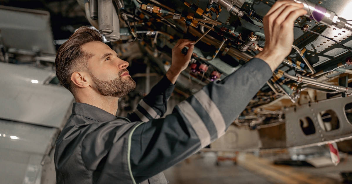 technician checking airplane parts