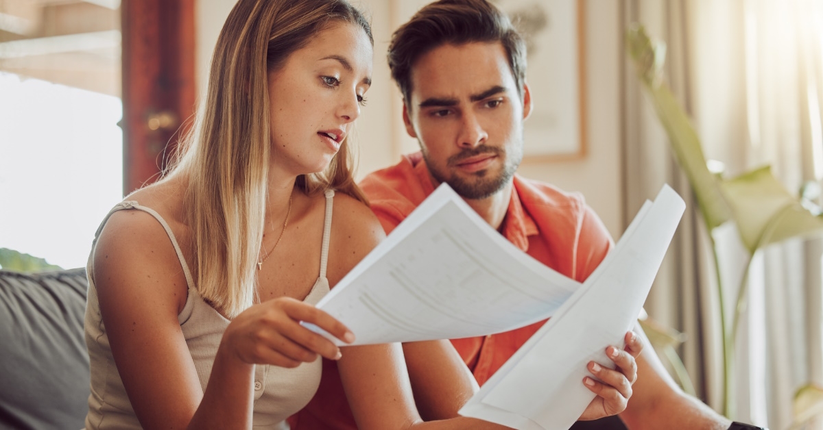 young couple checking out utility bills