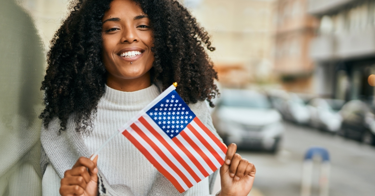 woman holding United States flag