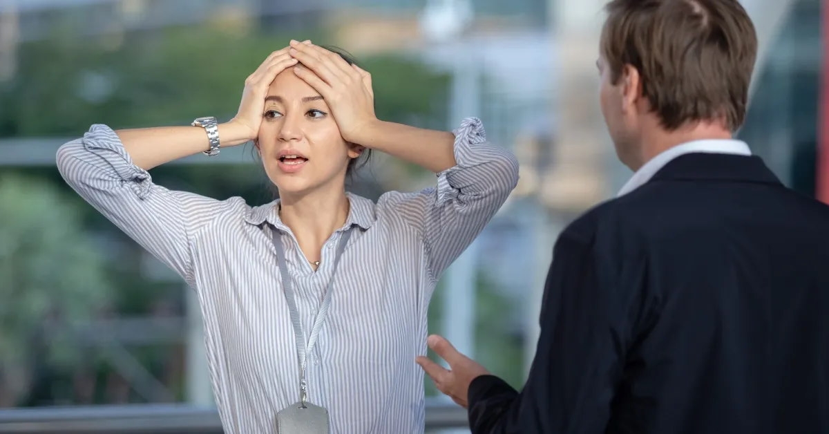 boss expressing disapproval to a female employee.