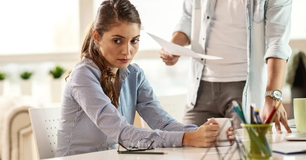 businesswoman being chastised by her superior.