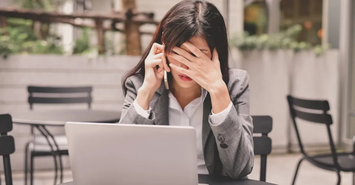 woman grappling with work related stress.