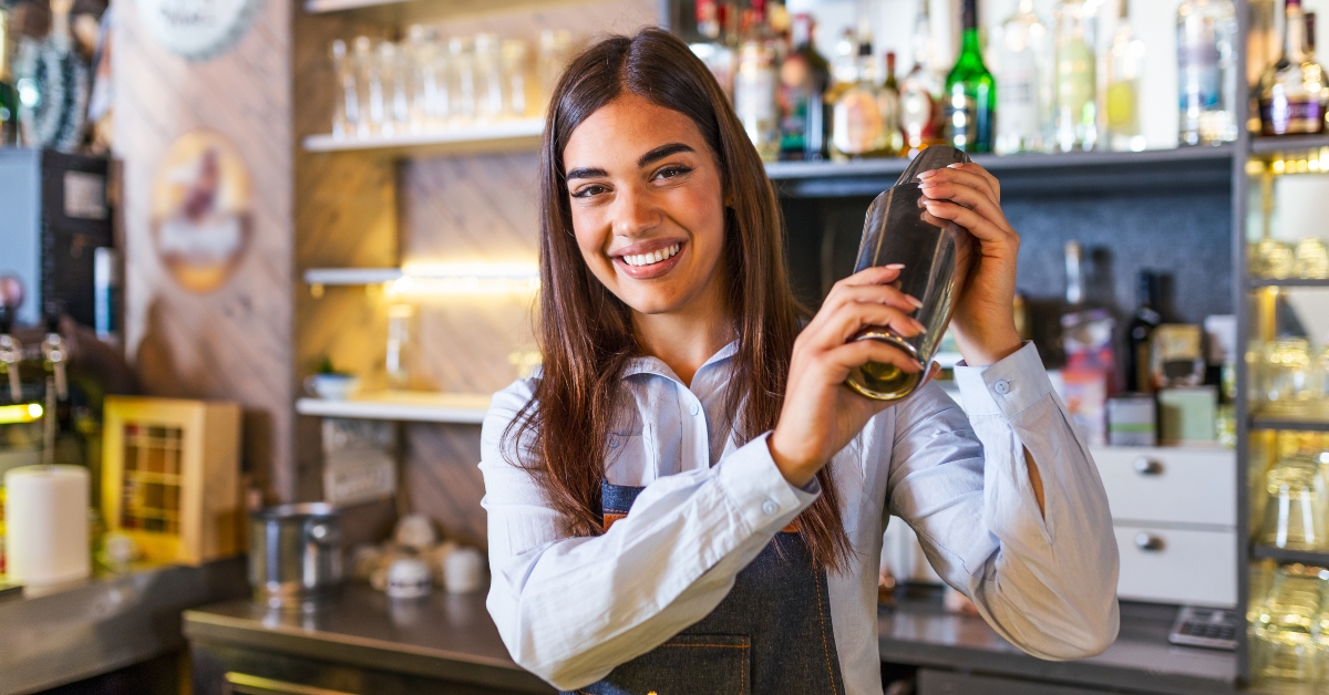  female worker at bartender desk 
