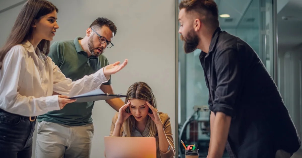 stressed colleagues having a meeting in the office.