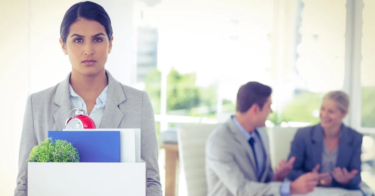 A businesswoman being let go from her job.