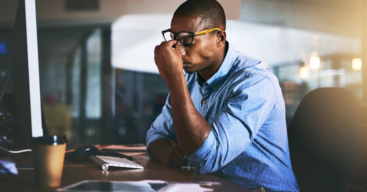 Stressed man at laptop
