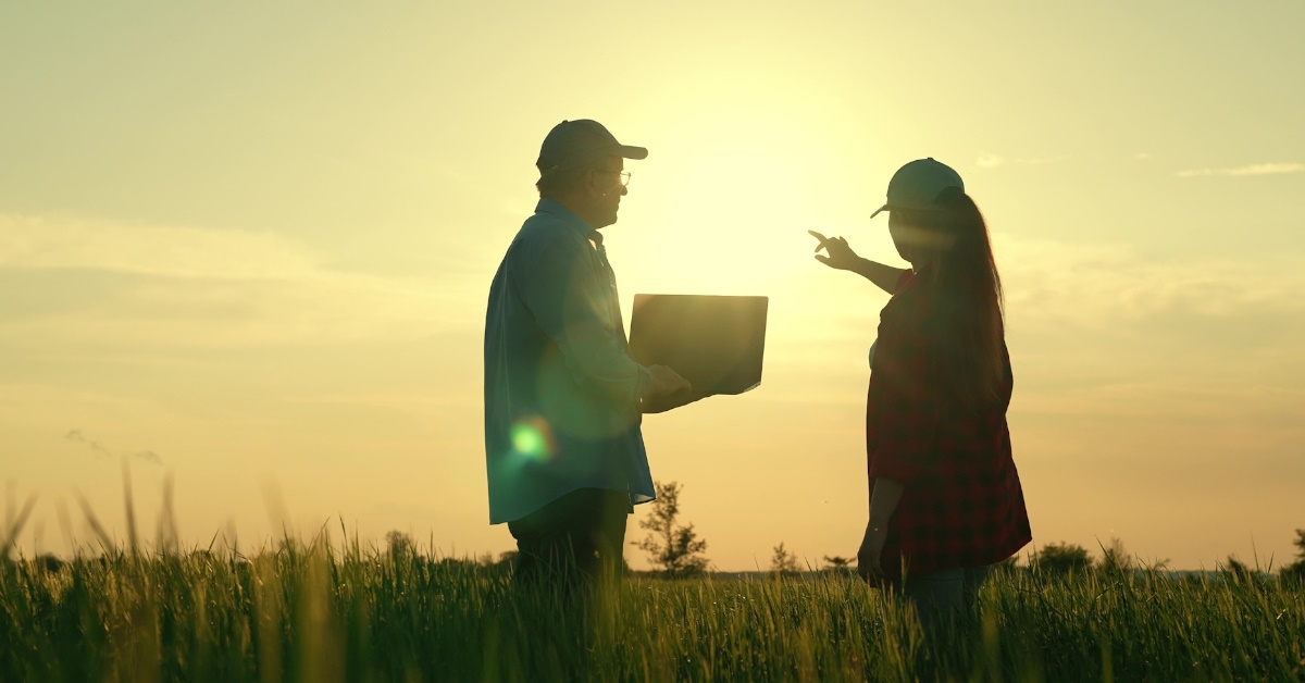 farmers discussing field projects together