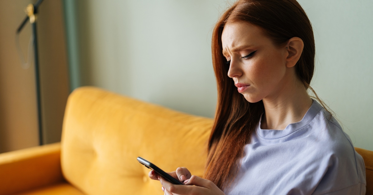 Woman concerned on her smartphone