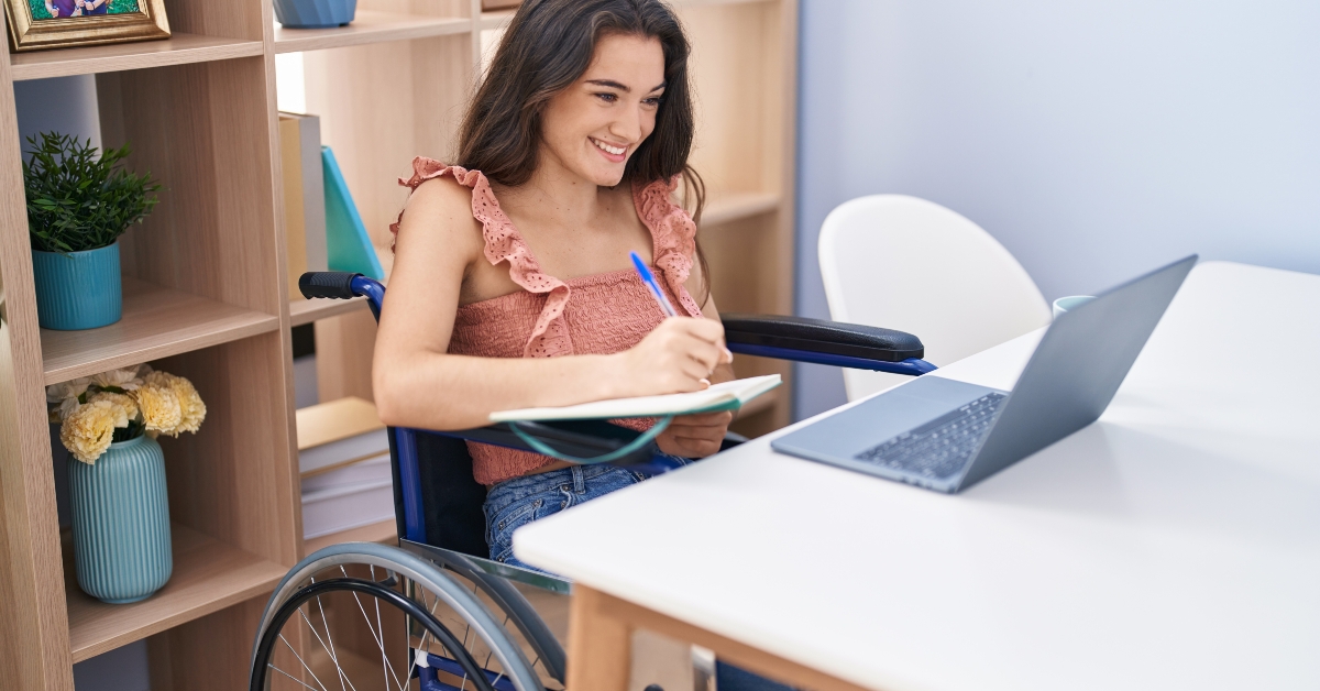 woman sitting on wheelchair studying