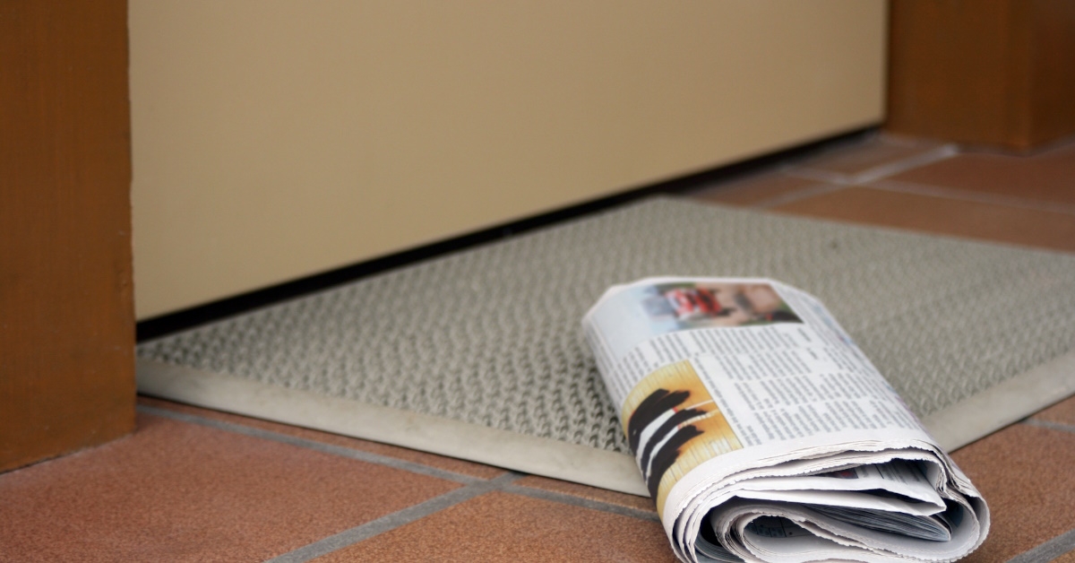 Newspaper at door mat