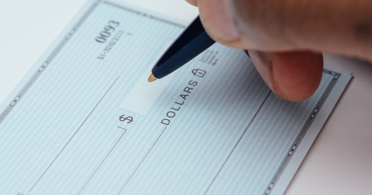 Someone writing a check