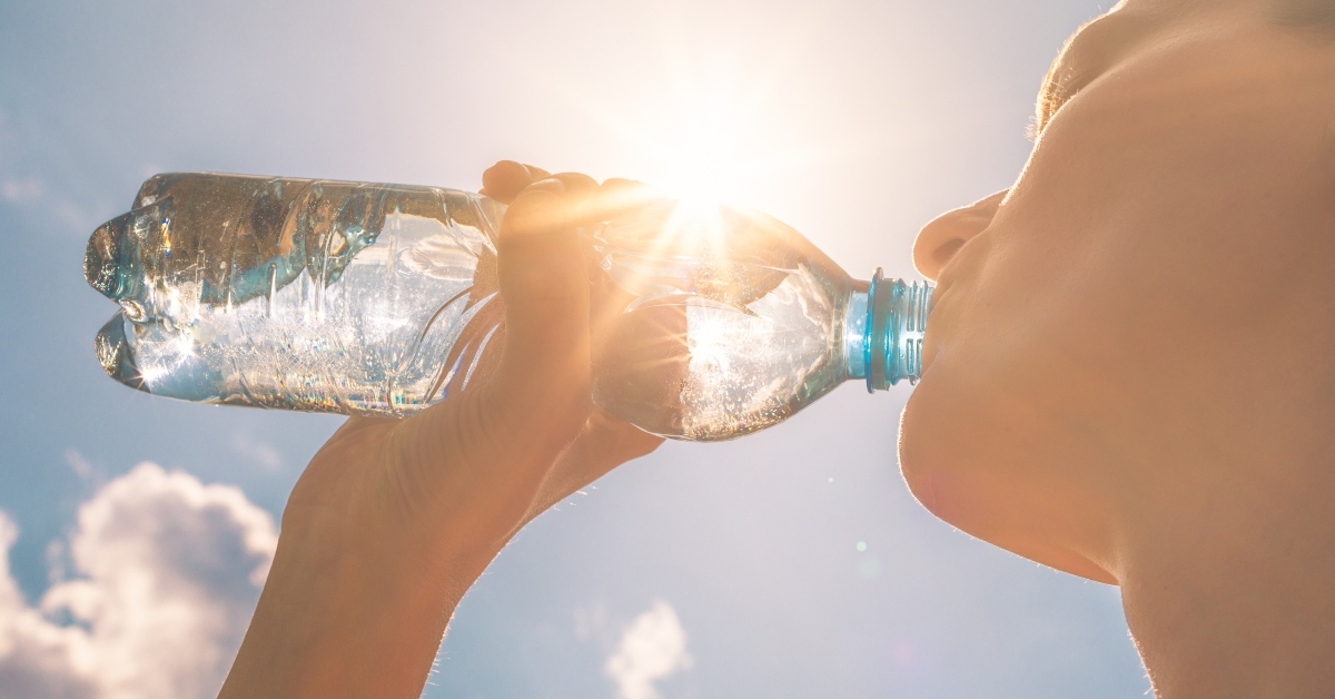 Woman drinking bottle of water