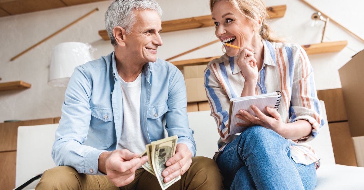 elderly couple counting money