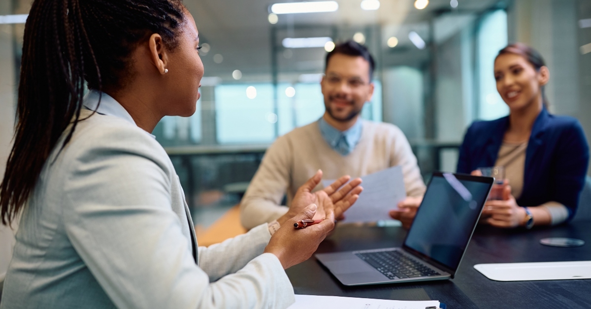 financial advisor talks to couple