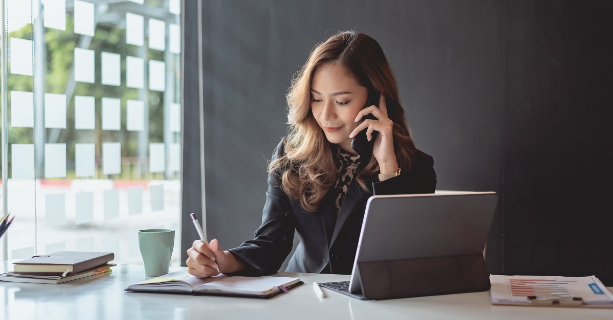 smiling and talking on phone