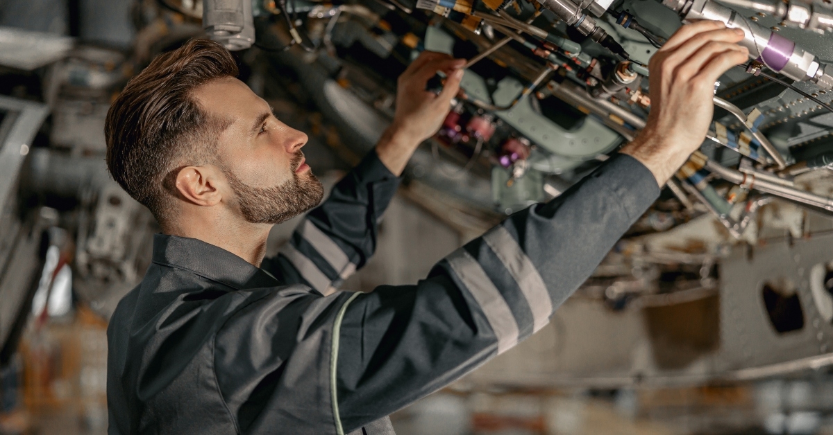 aviation mechanic checking aircraft