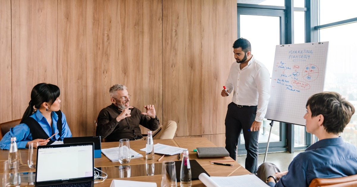 multinational team discuss marketing strategy