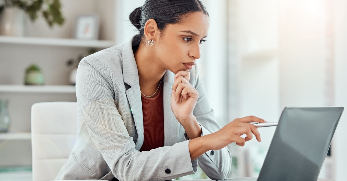 Serious, laptop and professional businesswoman