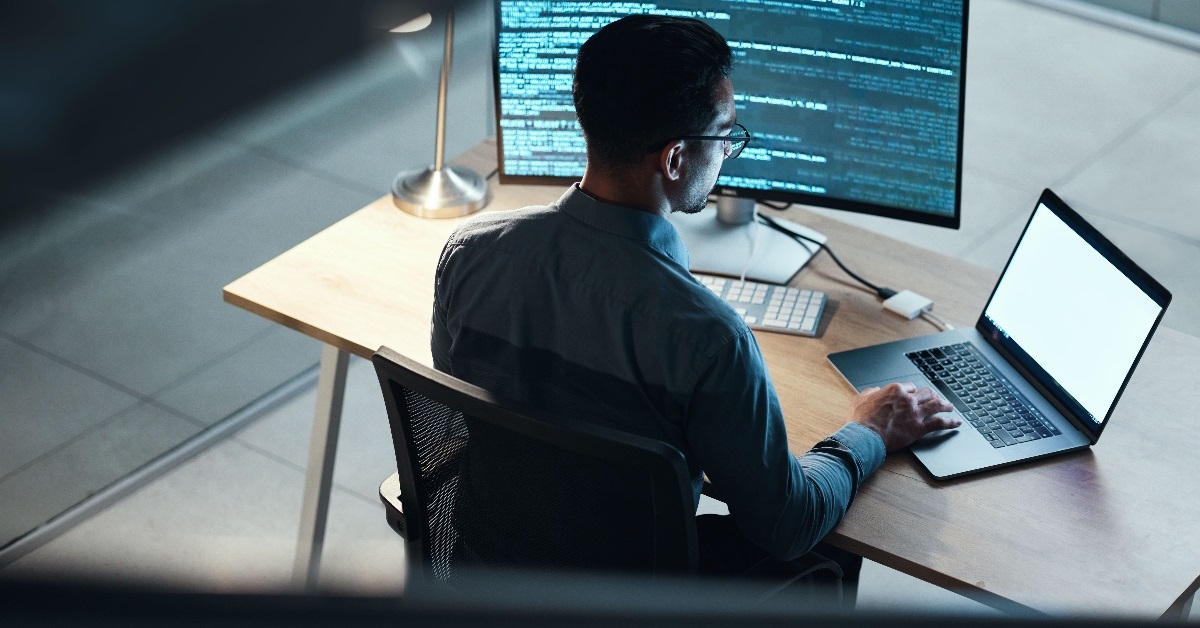 male programmer coding late at night