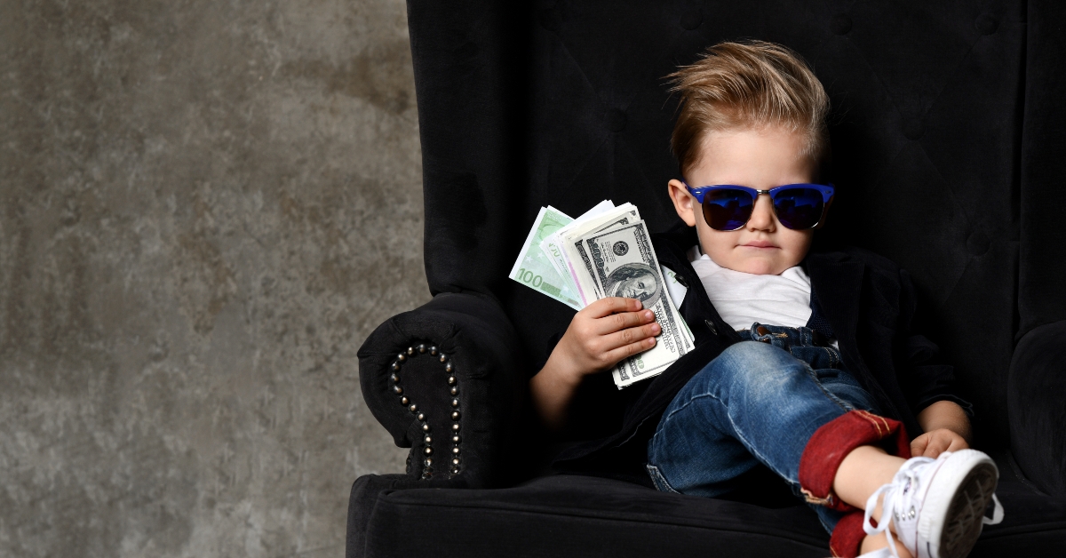 Boy with a bundle of money