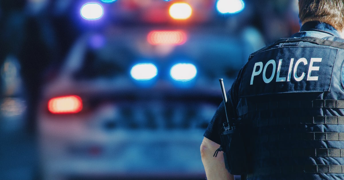 police in street with autompbile