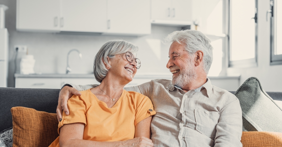 Happy laughing older married couple talking