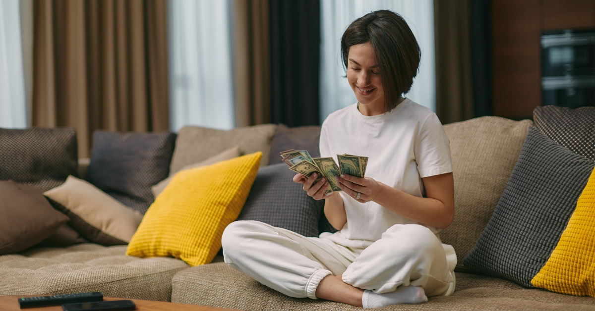 young woman counting cash