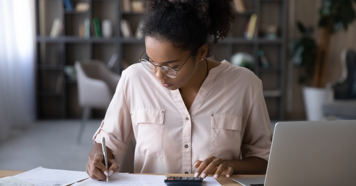 woman sit at desk manage budget