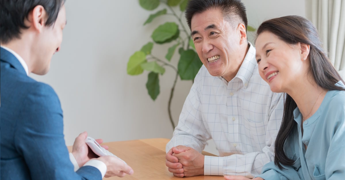 Senior couple talking to financial advisor