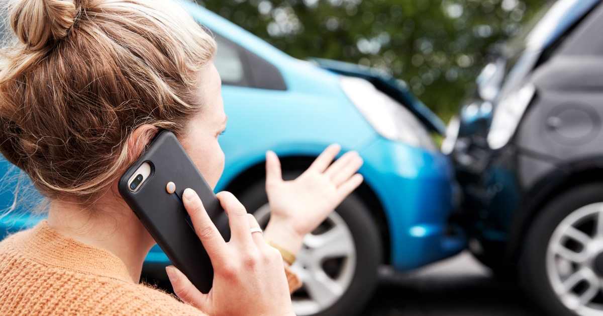 woman on phone after car accident