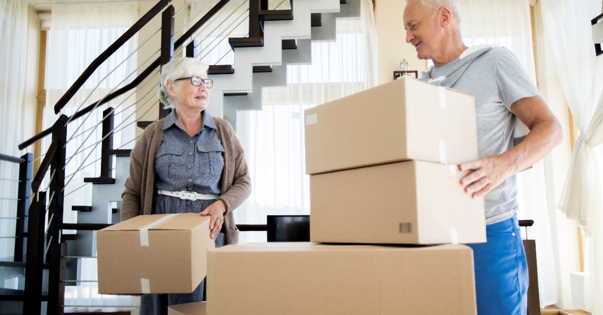 couple packing cardboard boxes