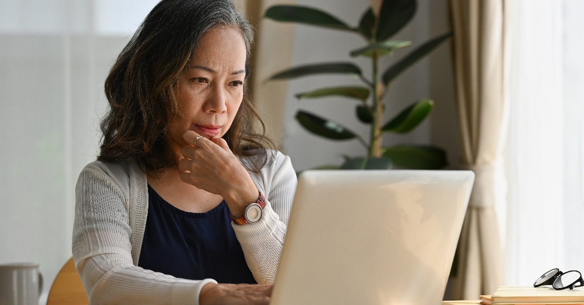 Woman working on a notebook computer.