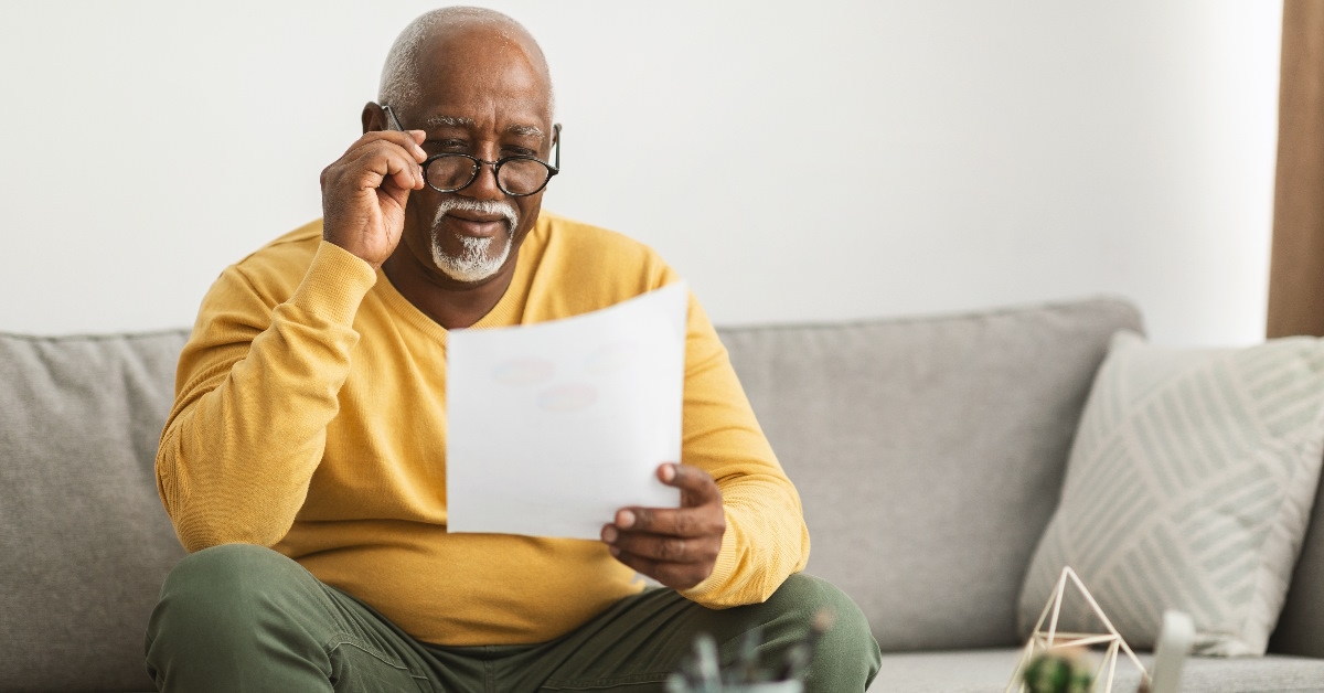 Senior man reading a document.