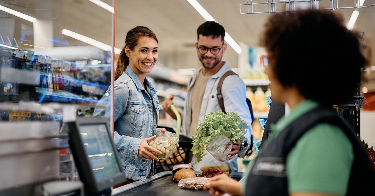 happy couple buying groceries